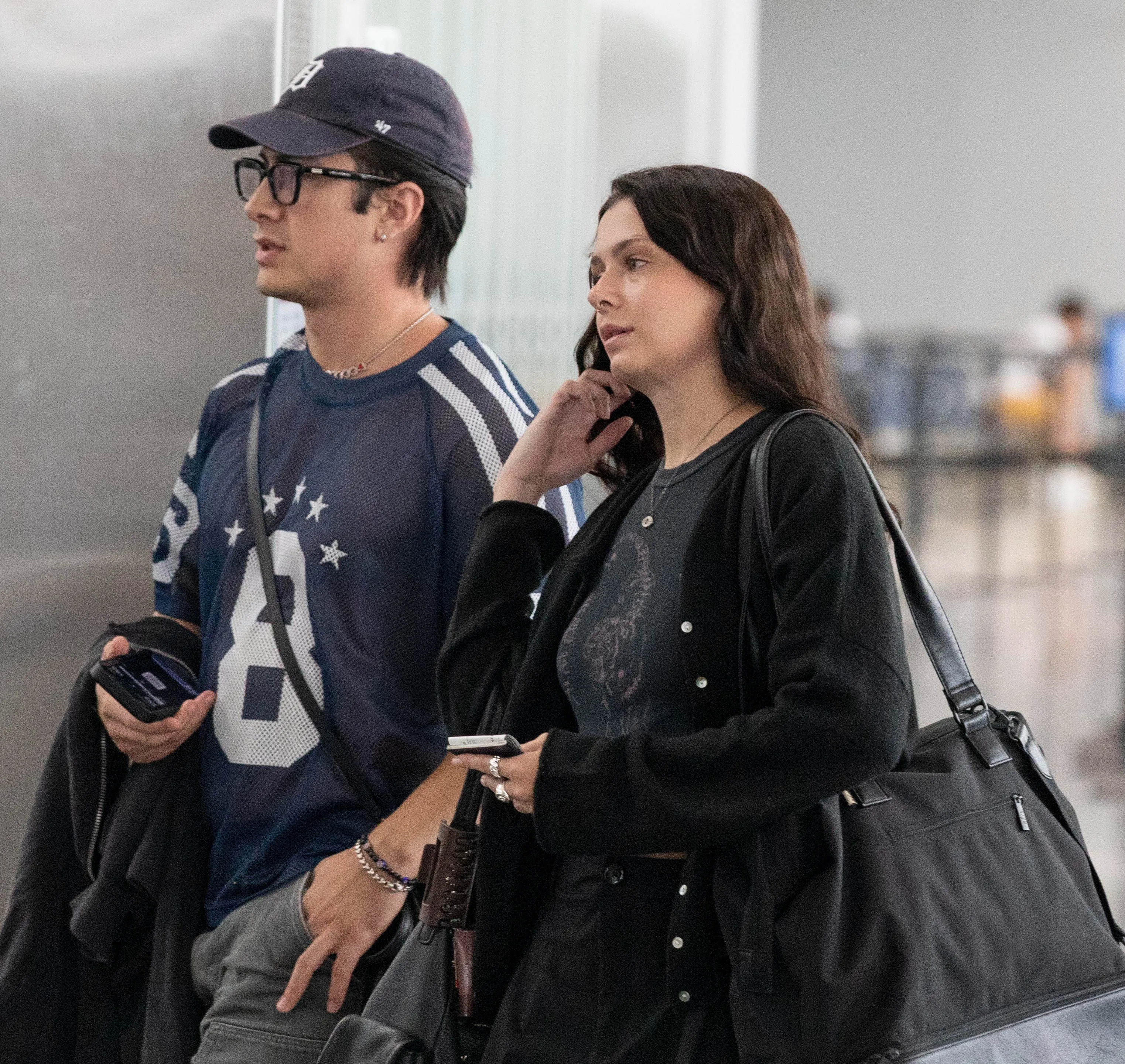 Hudson Williams and Katelyn Rose Larson at an airport.