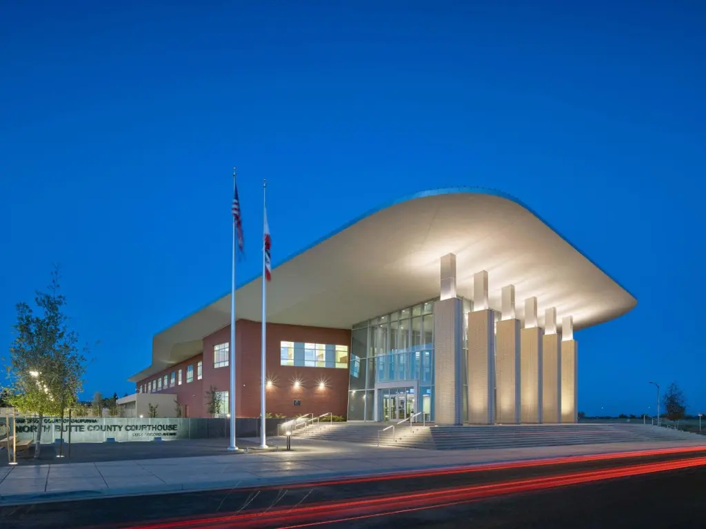 Exterior view of the Butte County Chico Courthouse at dusk.