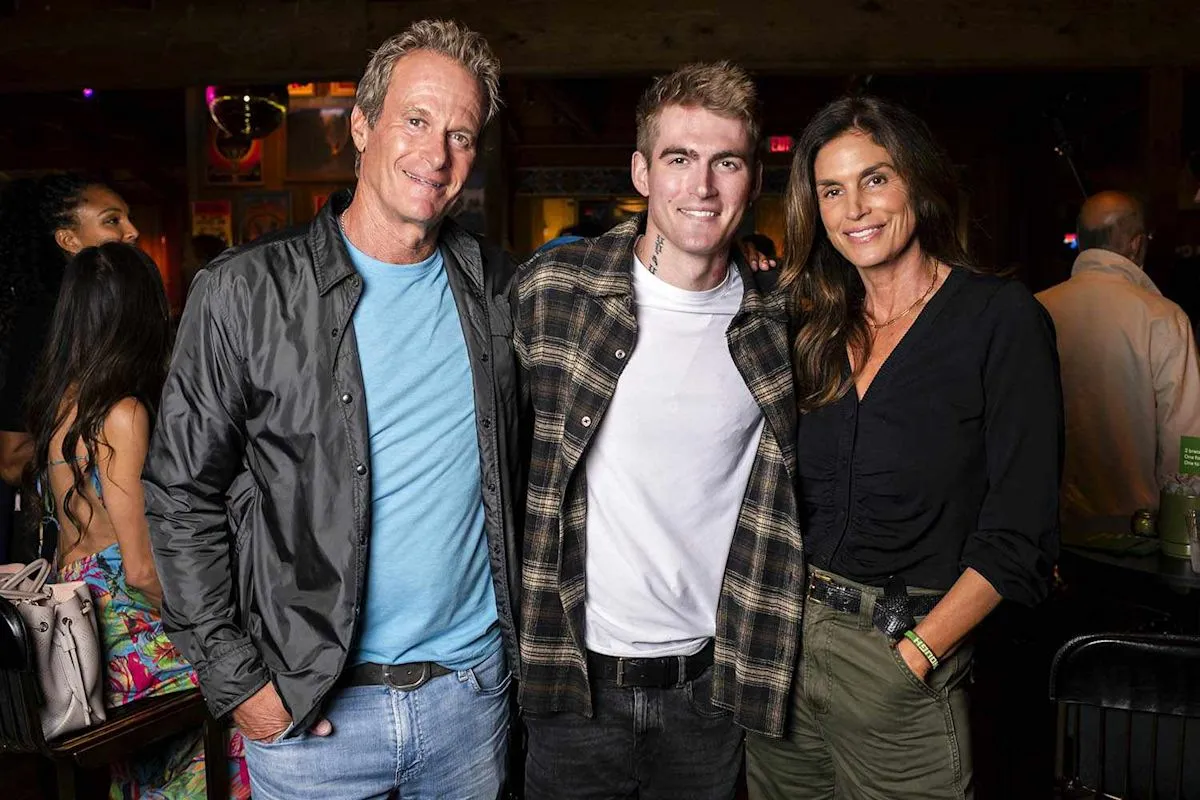 Rande Gerber and Cindy Crawford with their son Presley Gerber at an event.