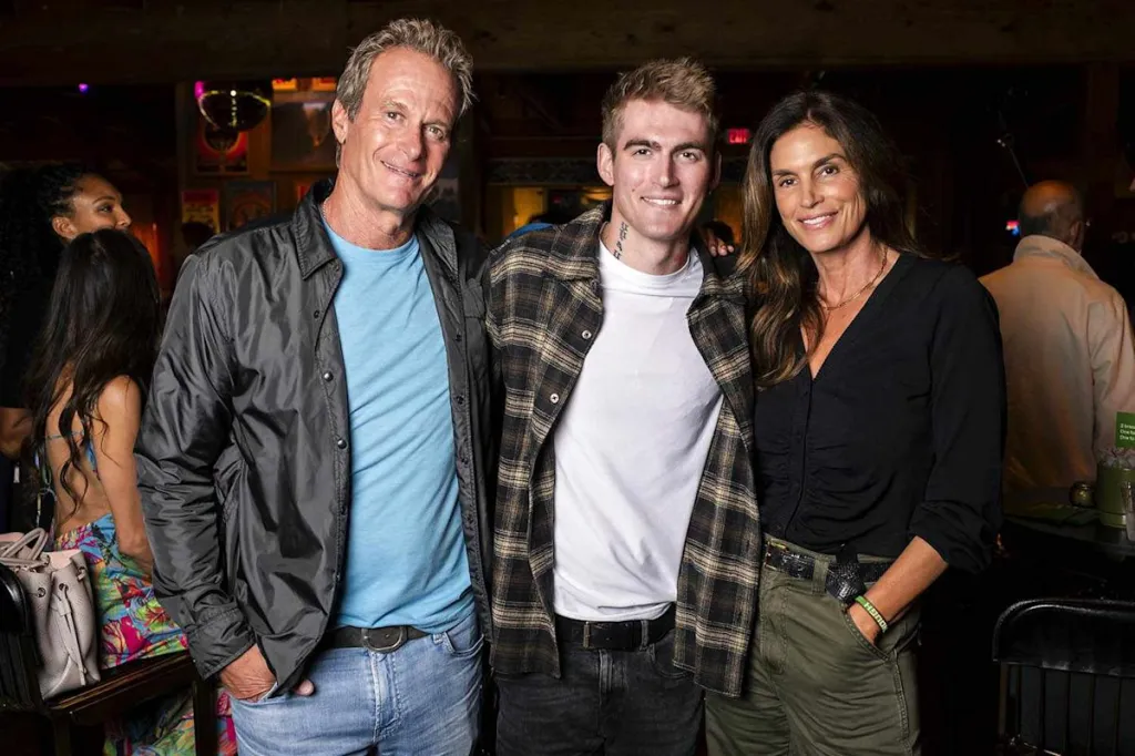 Rande Gerber, Presley Gerber, and Cindy Crawford smiling together.