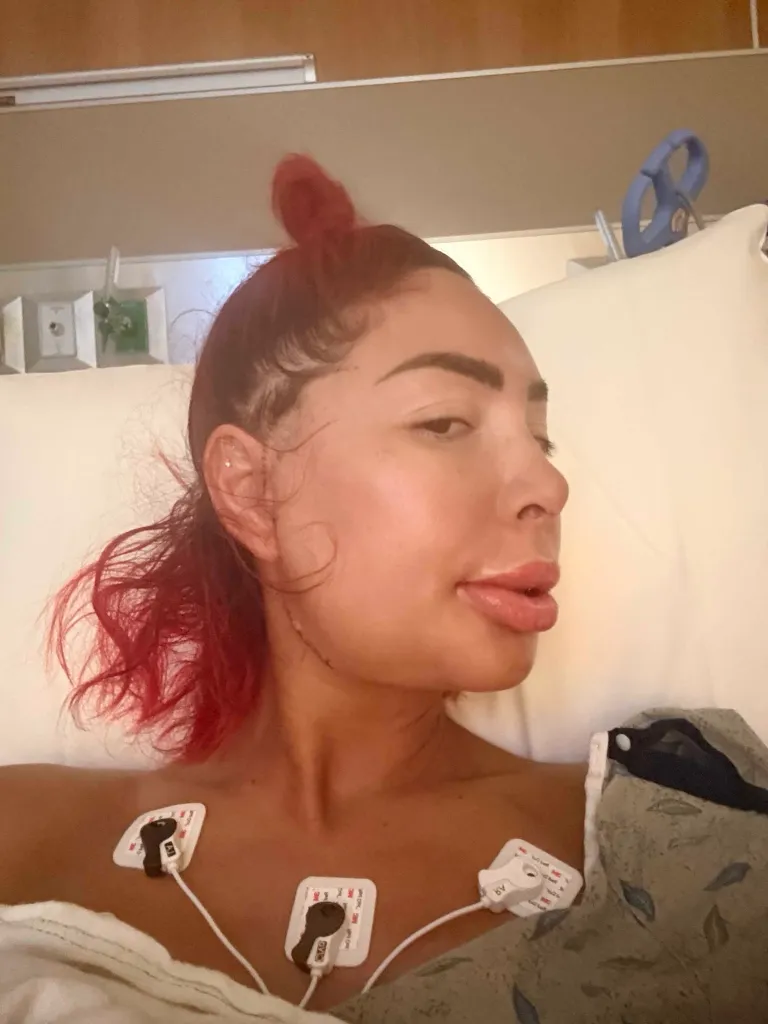 Farrah Abraham recovering in a hospital bed after major jaw surgery.