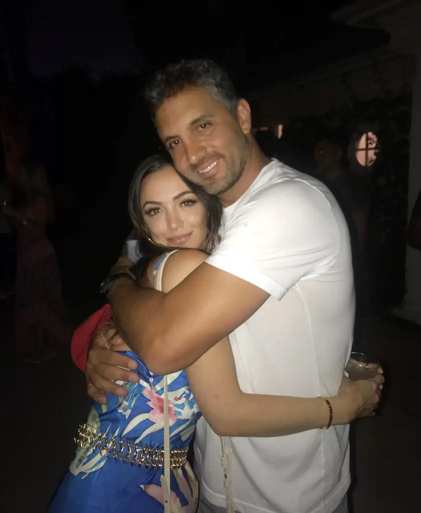 Farrah Brittany and Mauricio Umansky hugging.