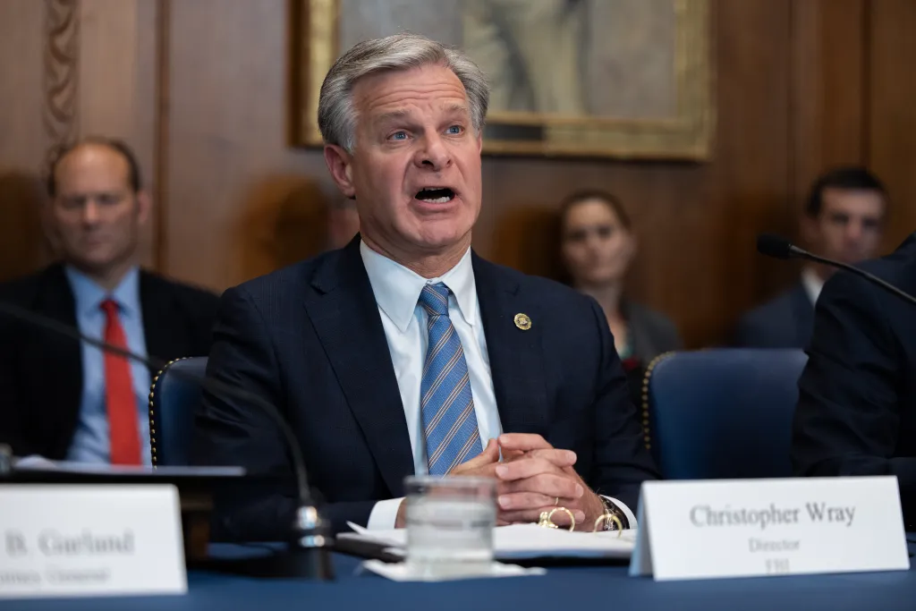 FBI Director Christopher Wray speaking at a meeting of the Justice Department's Election Threats Task Force.