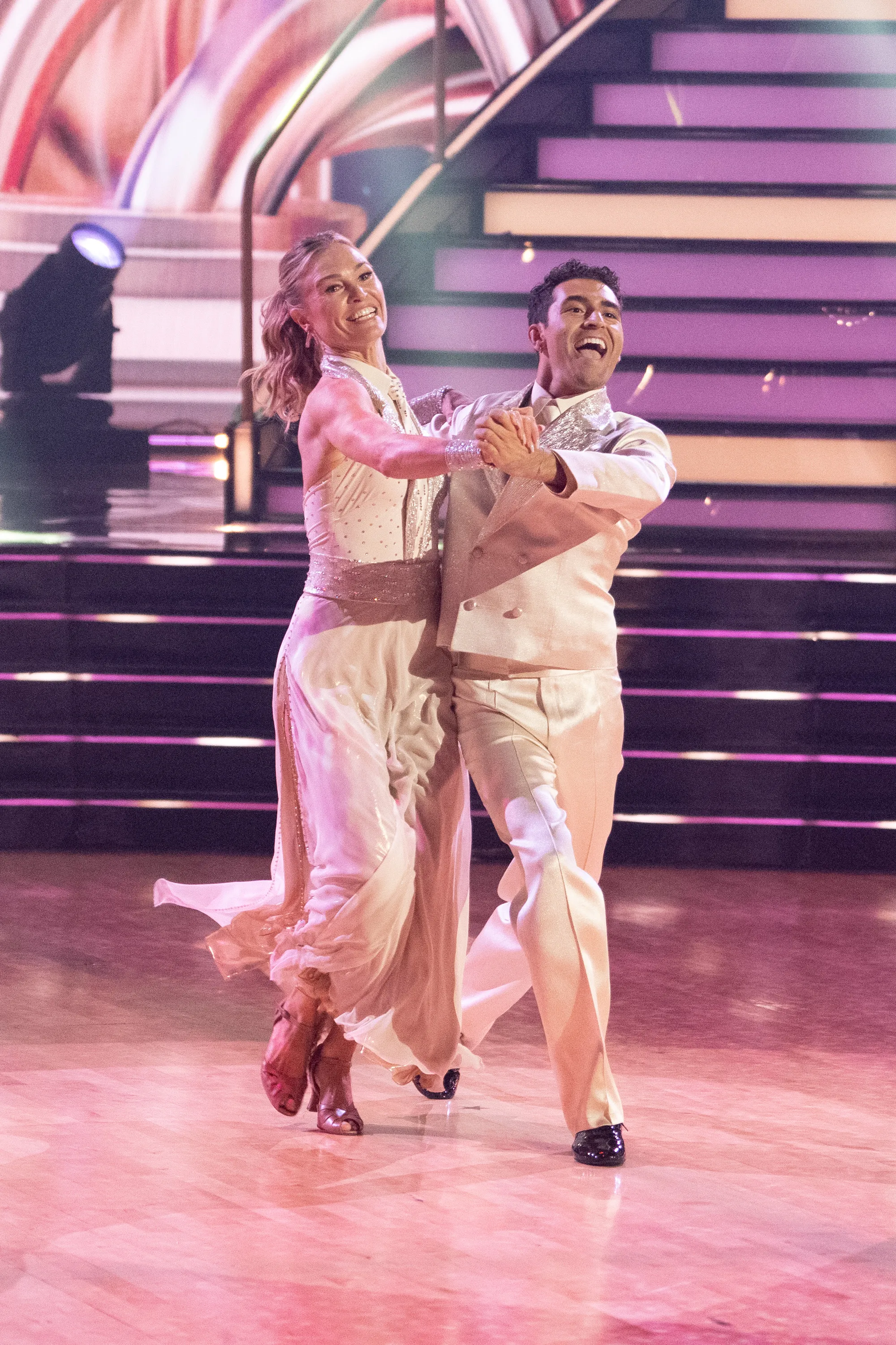 Julia Stiles and Ezra Sosa dancing together.