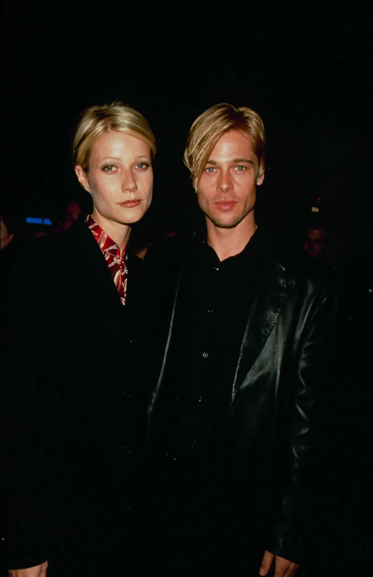 Gwyneth Paltrow and Brad Pitt posing for a photo.