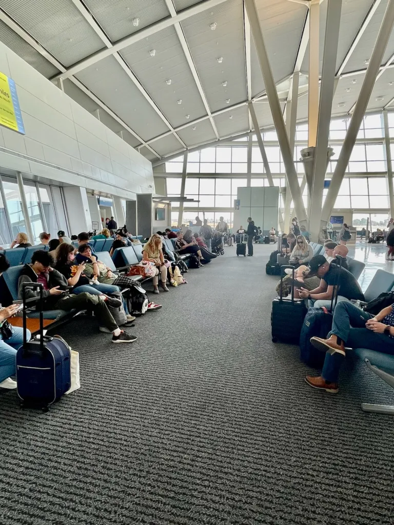 Passengers wait in the Fresno Yosemite International Airport terminal.