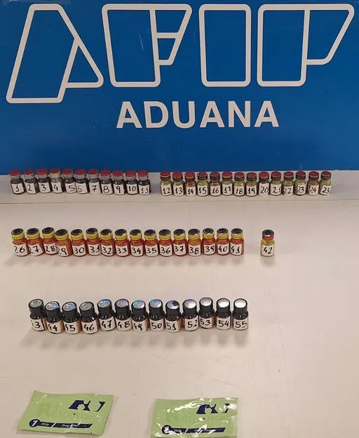 Vials of poppers numbered 1-55 in front of an 