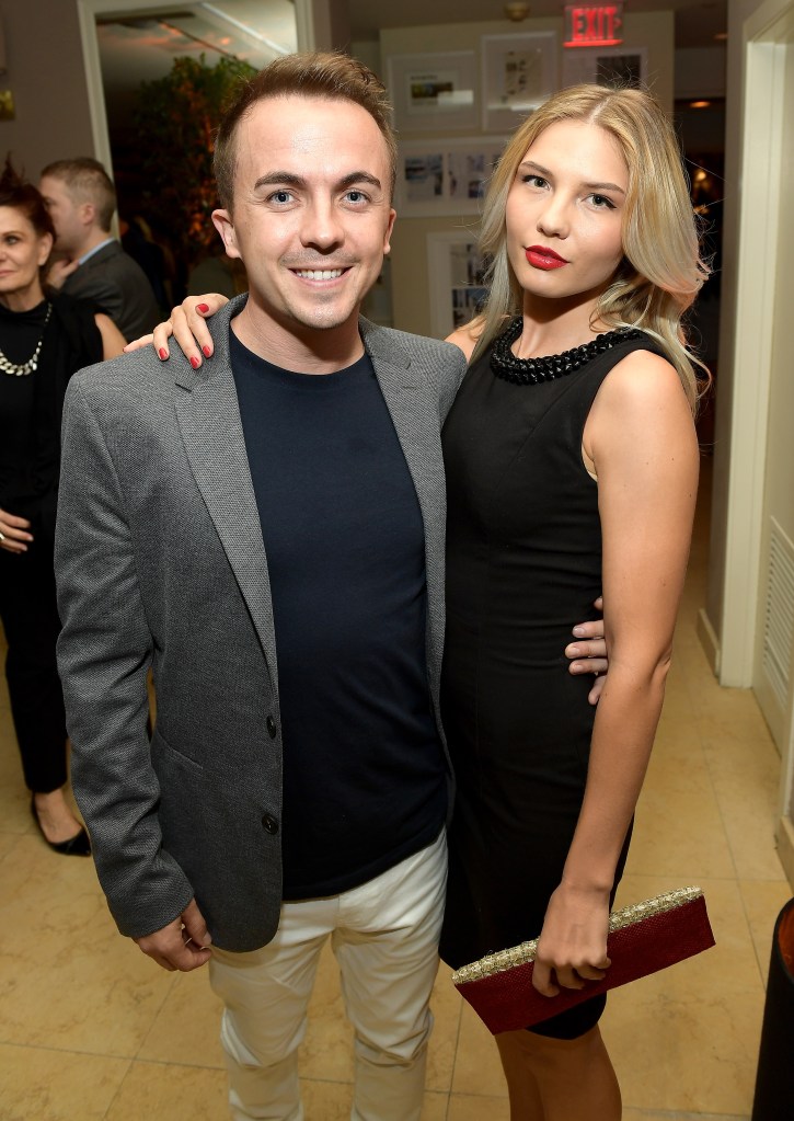 Frankie Muniz and Paige Price pose for a photo.