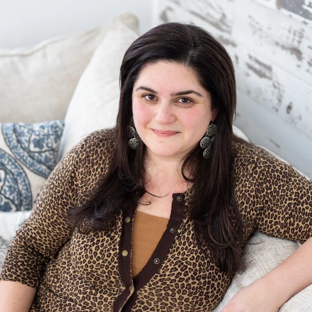 Olivia Howell, CEO of FreshStartsRegistry.com, sitting and smiling.