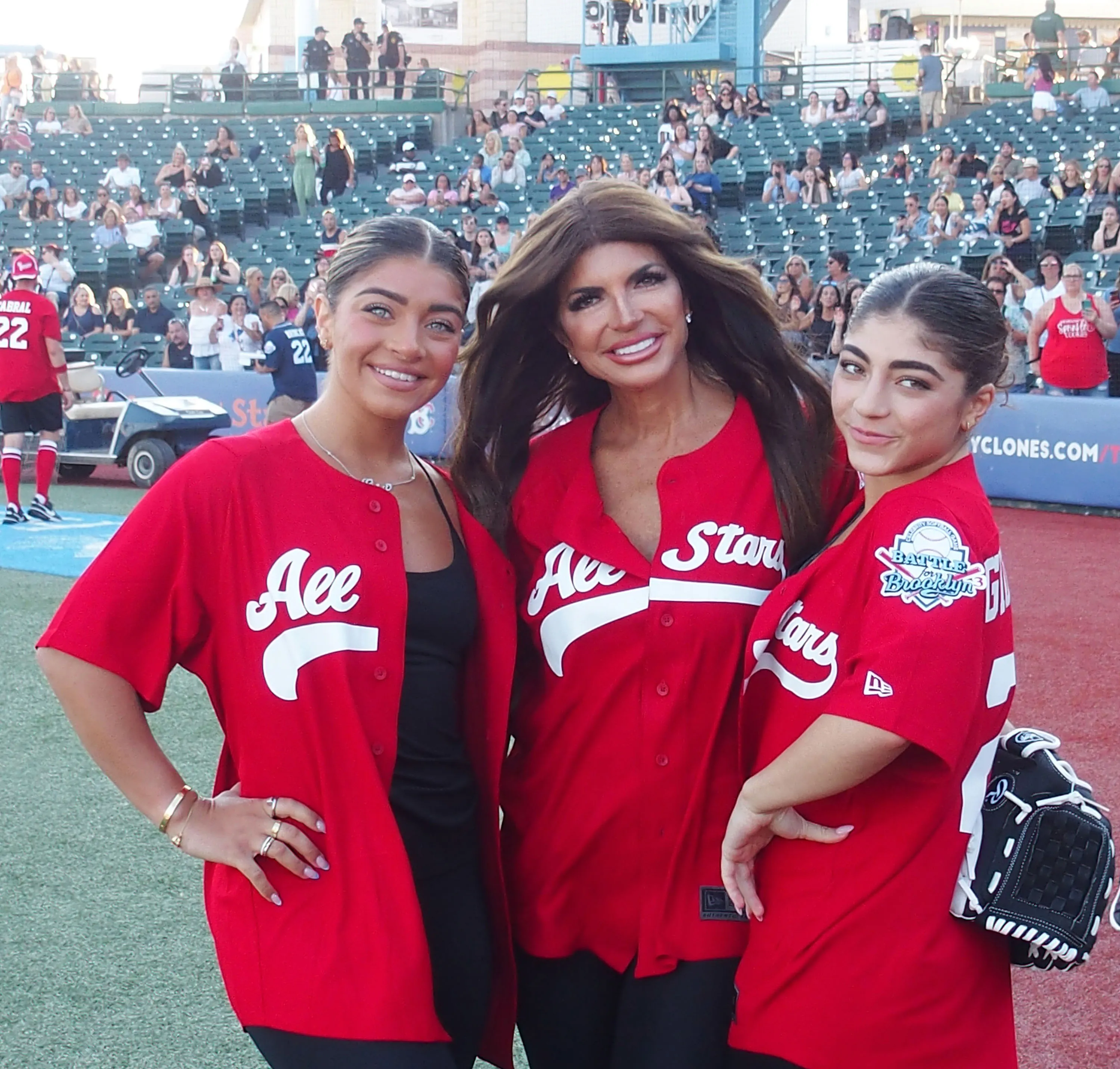 Gia Giudice, Teresa Giudice, and Milania Giudice pose in red 