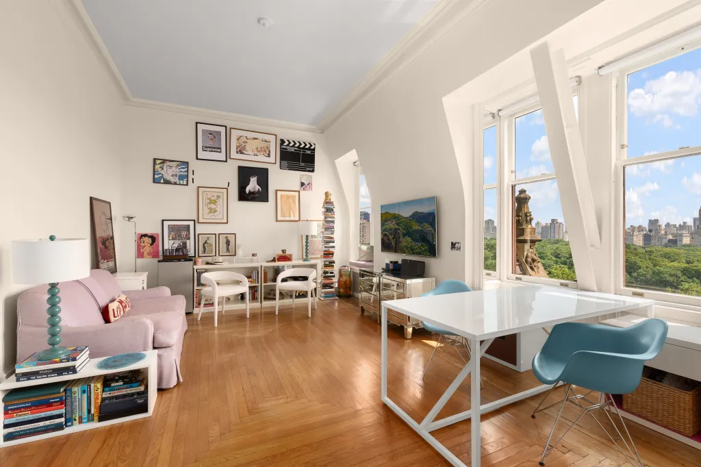 The apartment retains original details like 11-foot ceilings, coved archways and two woodburning fireplaces.