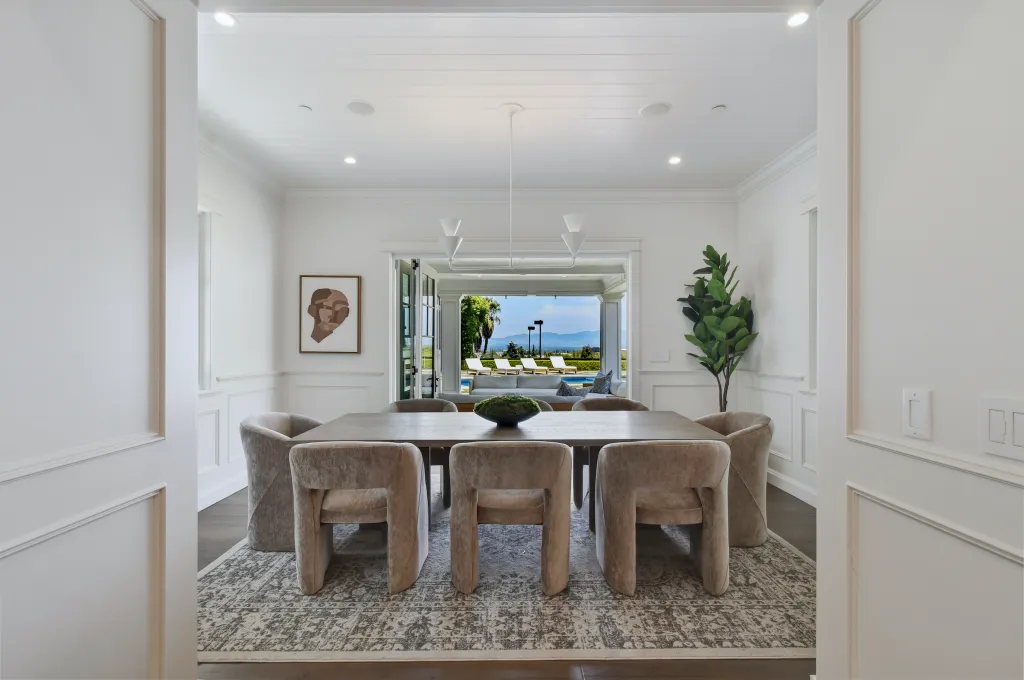 The dining room opens to the outdoors and gorgeous views.