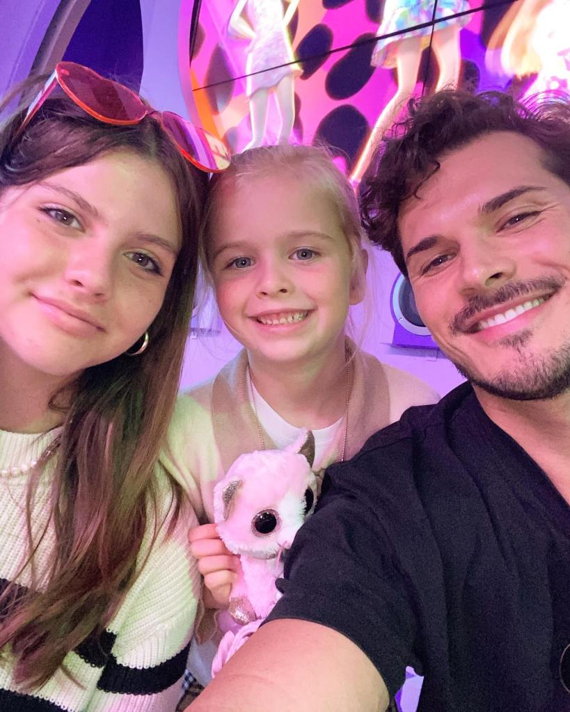 Gleb Savchenko poses for a selfie with his two daughters.