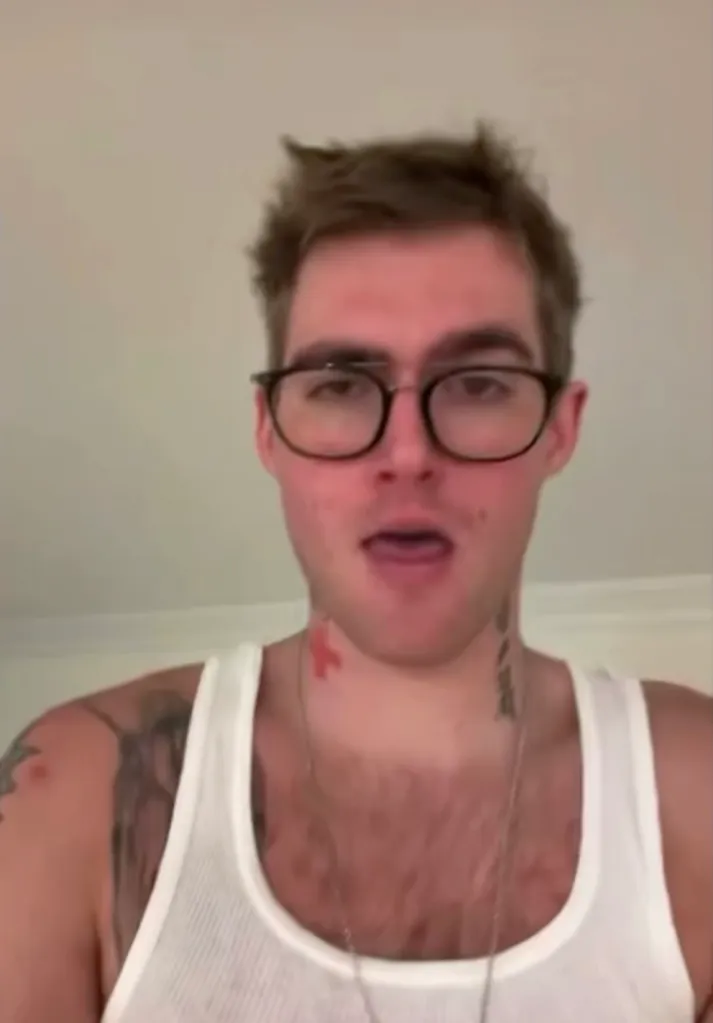 Presley Gerber wearing glasses and a white tank top.