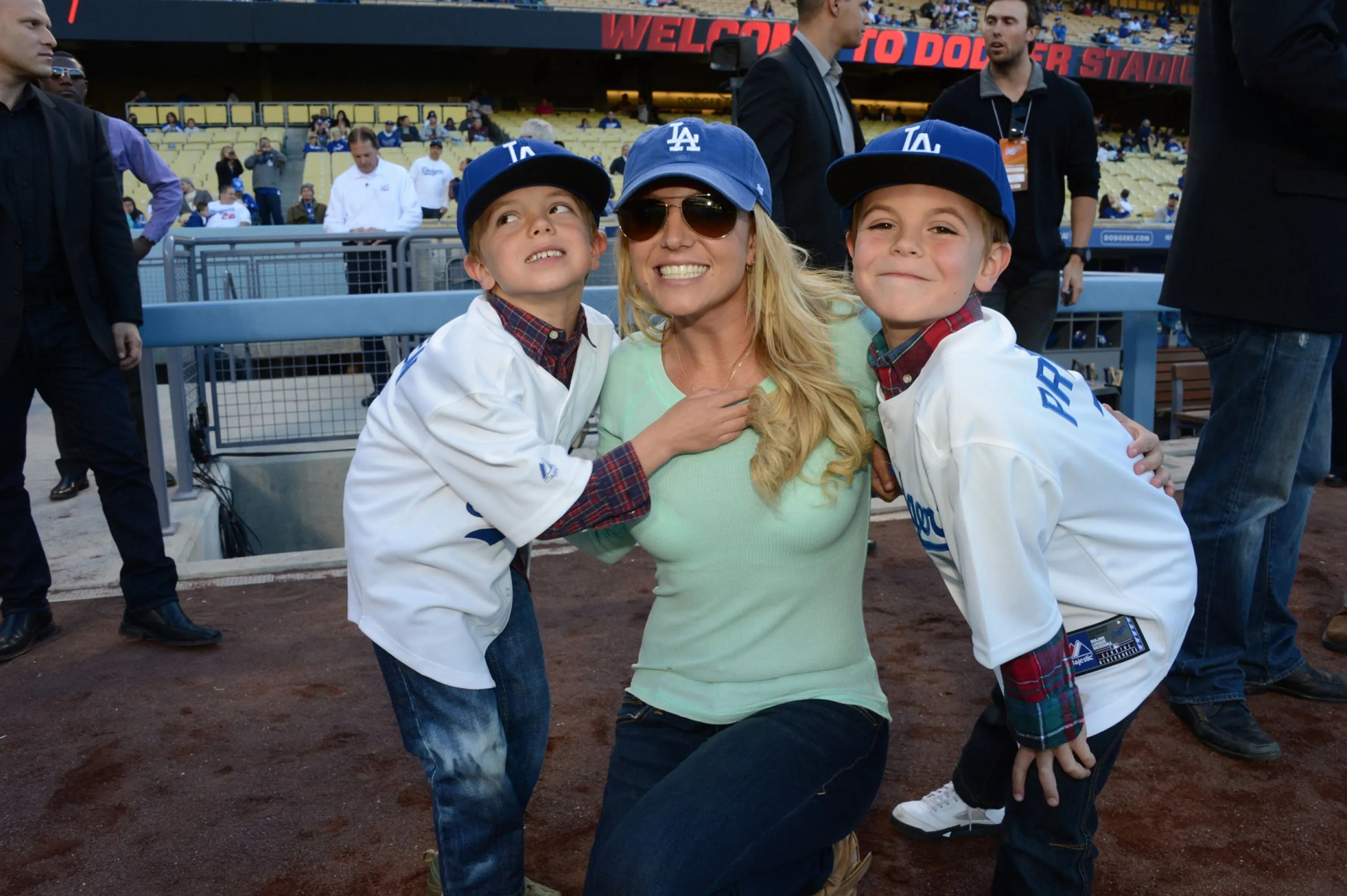 Britney Spears and her sons, Jayden James Federline and Sean Preston Federline, posing at a Dodgers game.