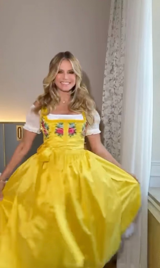 Heidi Klum in a yellow dirndl.