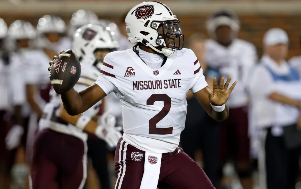 Henry Belin IV of the Missouri State Bears throwing a football downfield.