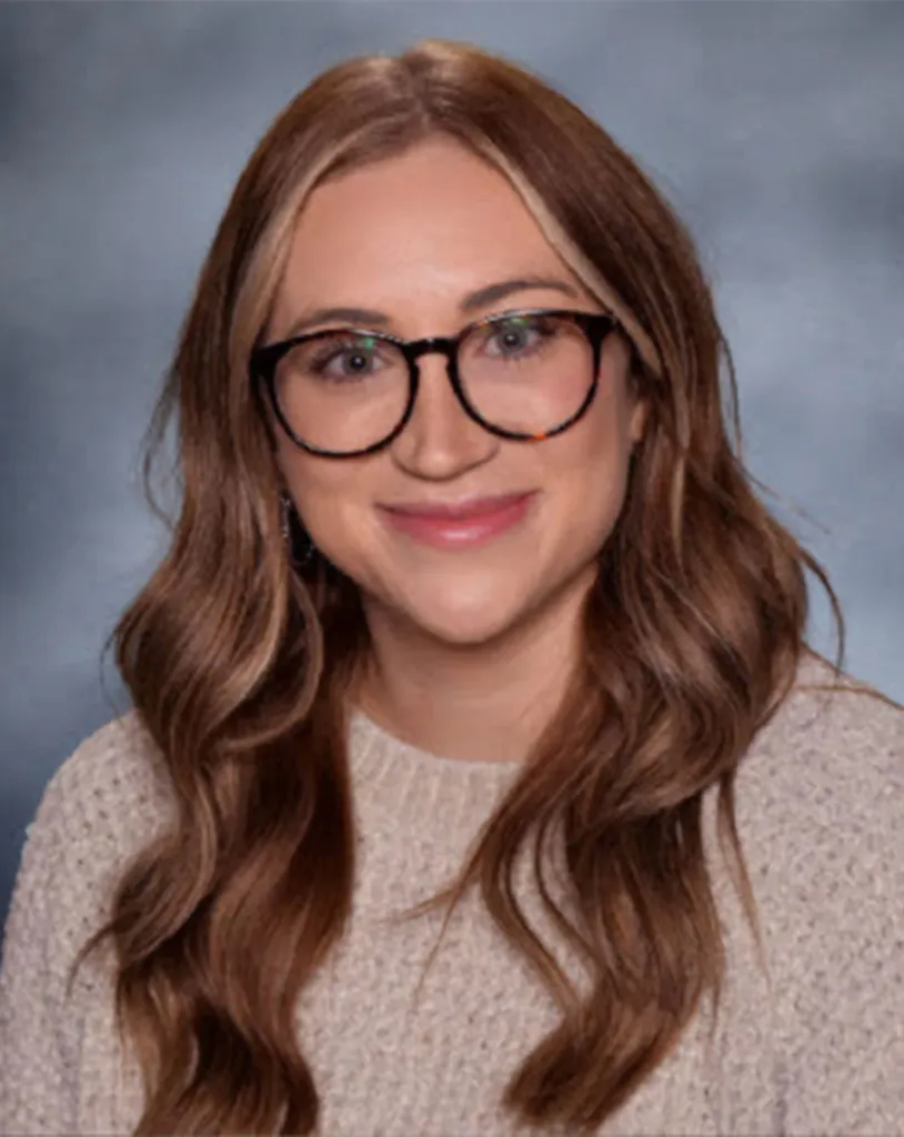 A headshot of Brianna Coppage, the high school English teacher who was placed on leave.