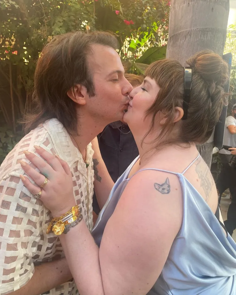 A couple kissing.