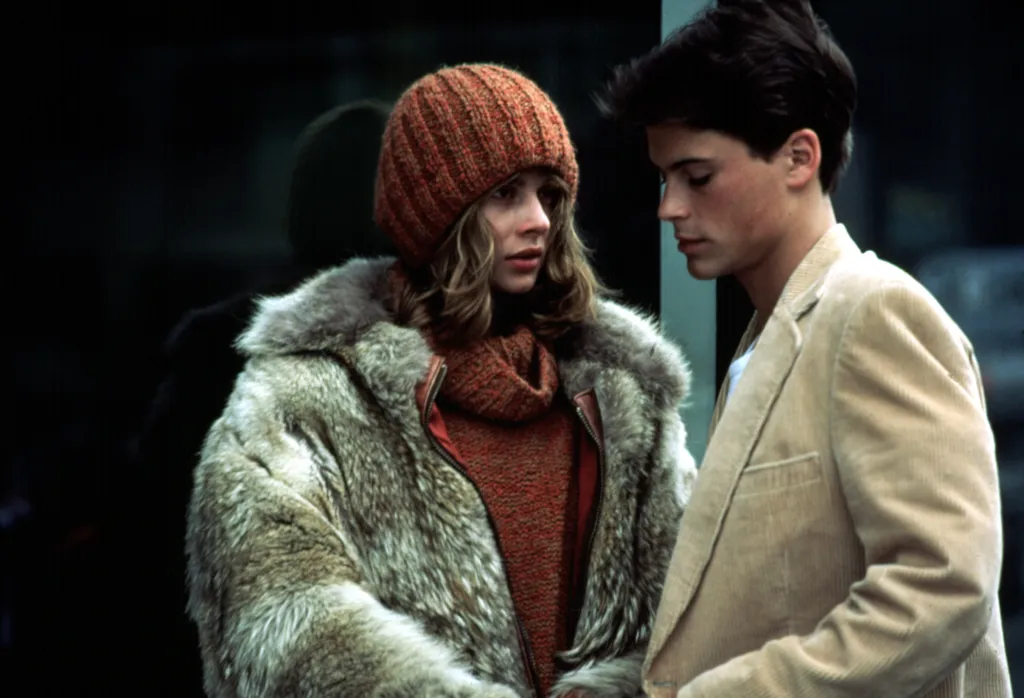Nastassja Kinski in a fur coat and Rob Lowe in a corduroy jacket in 