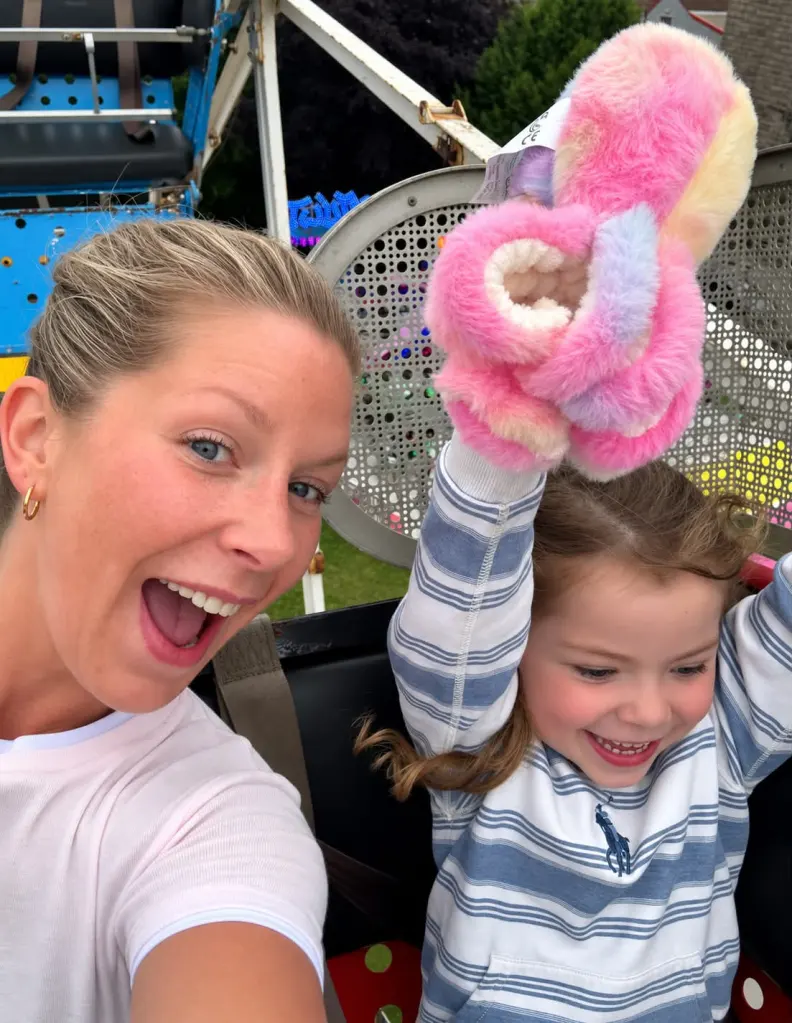 Sophie Dumas and her daughter Sienna on a fairground ride.