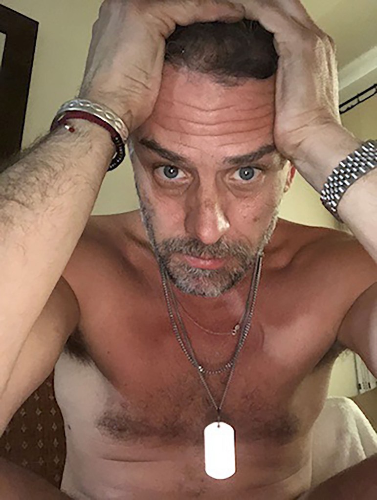 Hunter Biden looking distressed and shirtless, holding his hands on his head.