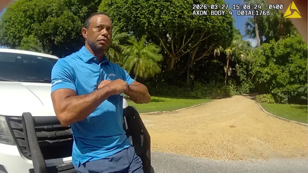 Tiger Woods performing a field sobriety test for sheriff's deputies.