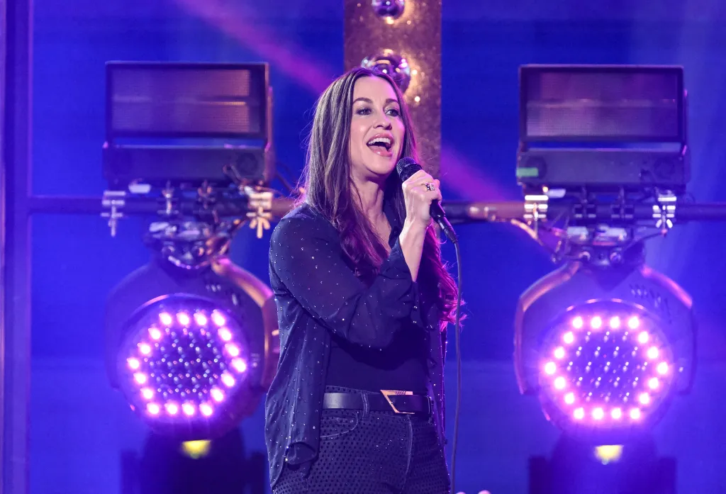 Alanis Morissette performs onstage.