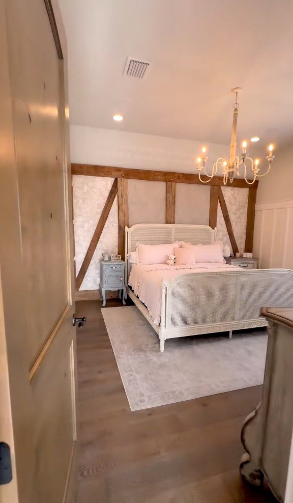 A themed bedroom includes whimsical wall art and rustic wood accents.