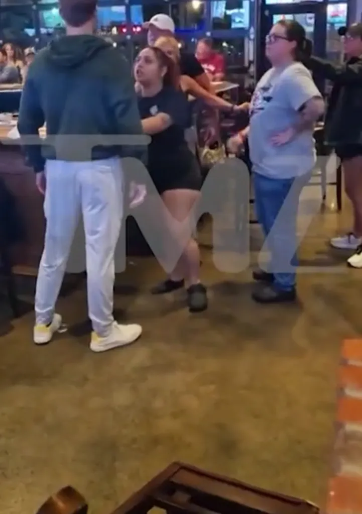 Brian Hickerson flinging a chair and getting handcuffed in a bar altercation.