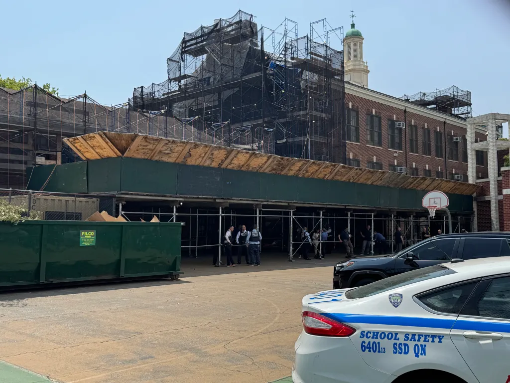 Investigators work at the scene where a body was reportedly found in a chimney at PS/IS 113 in Queens, Tuesday, June 30, 2026.