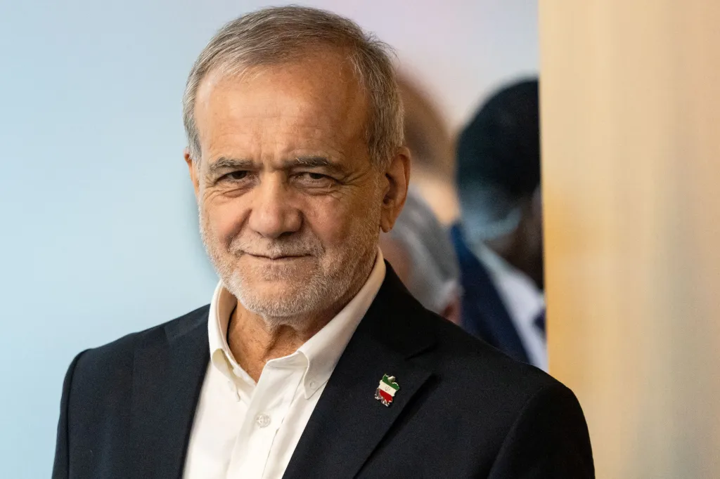 Masoud Pezeshkian, Iran's President, in a suit with a flag pin shaped like Iran.