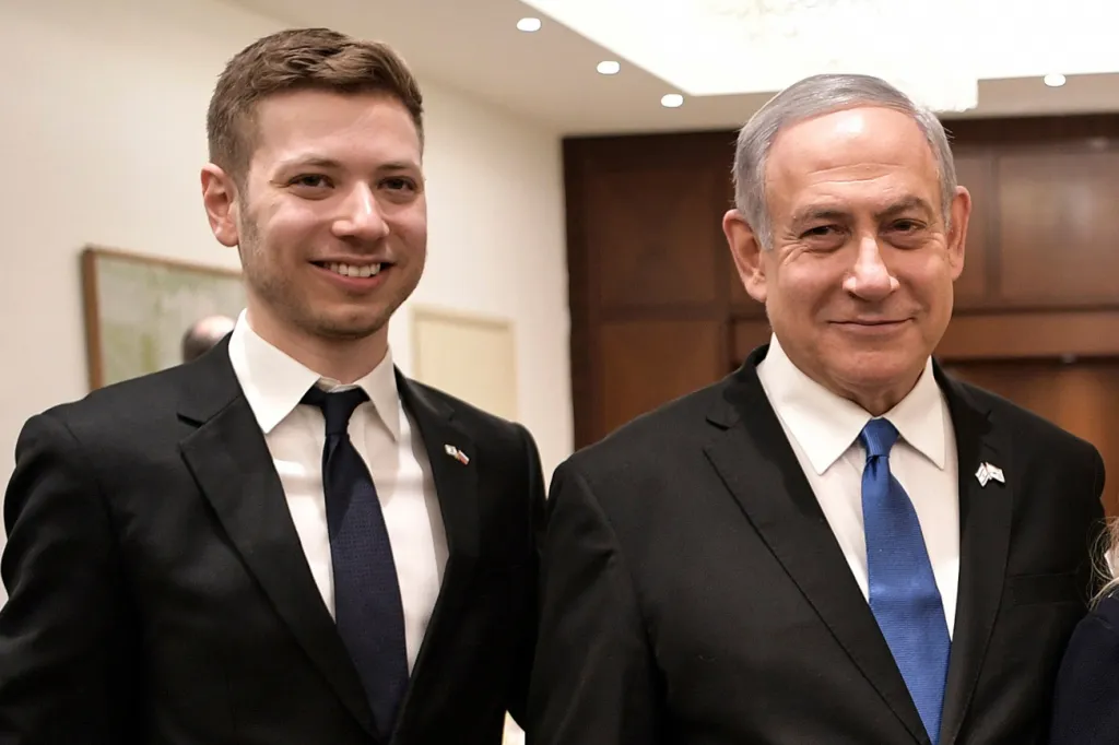 Israeli Prime Minister Benjamin Netanyahu and son Yair pose for a photo.