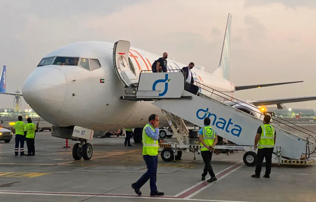 Israeli tourists leave a FlyDubai plane after landing in Dubai, United Arab Emirates.