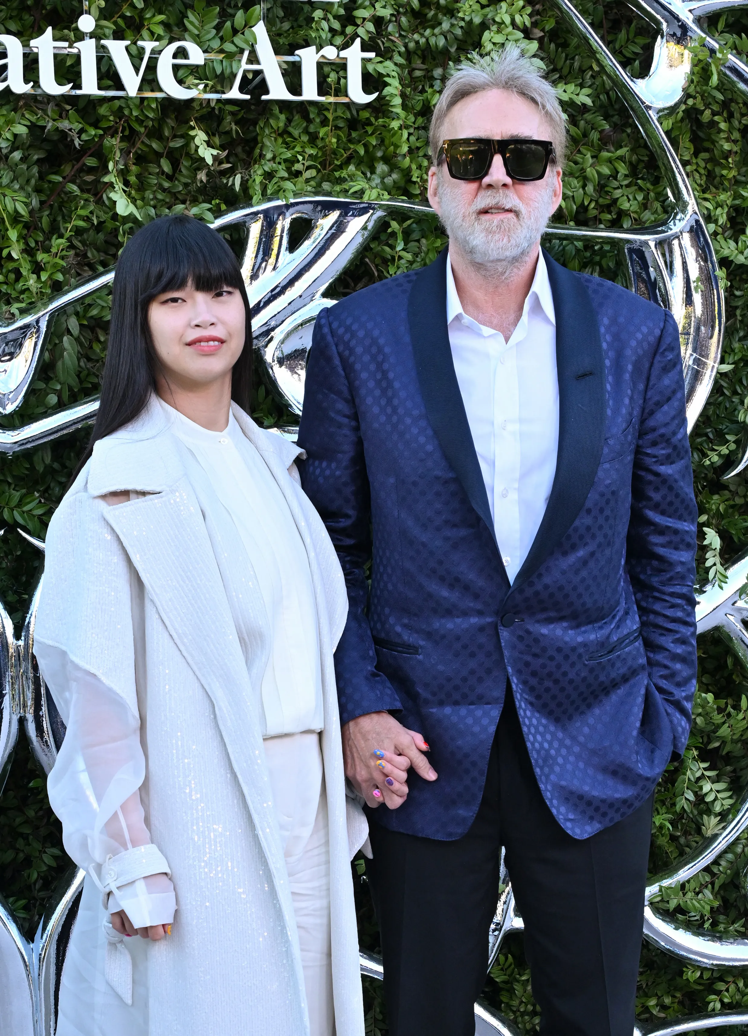 Riko Shibata and Nicolas Cage at the Lucas Museum of Narrative Art opening night.
