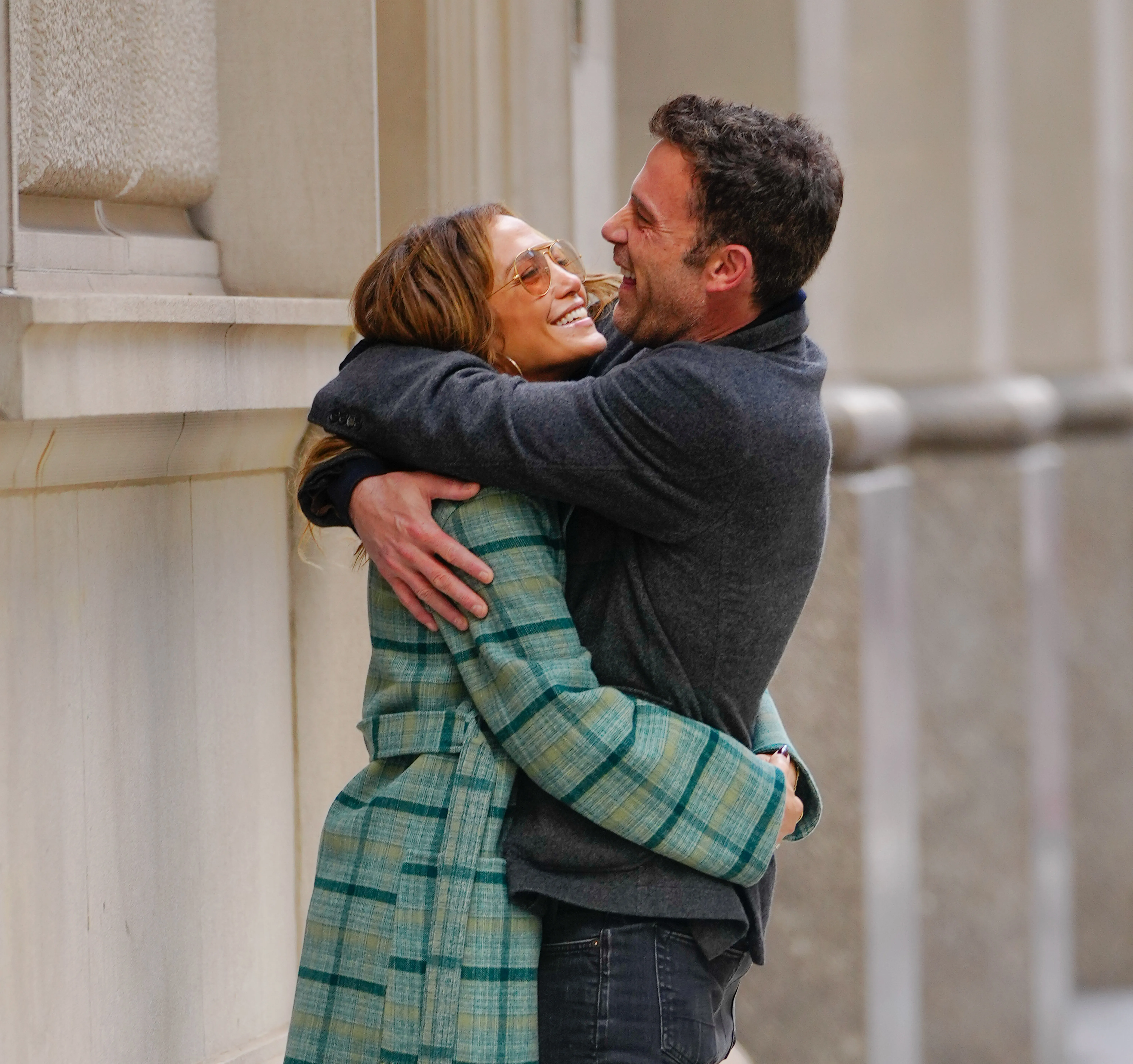 Jennifer Lopez and Ben Affleck embracing and laughing.