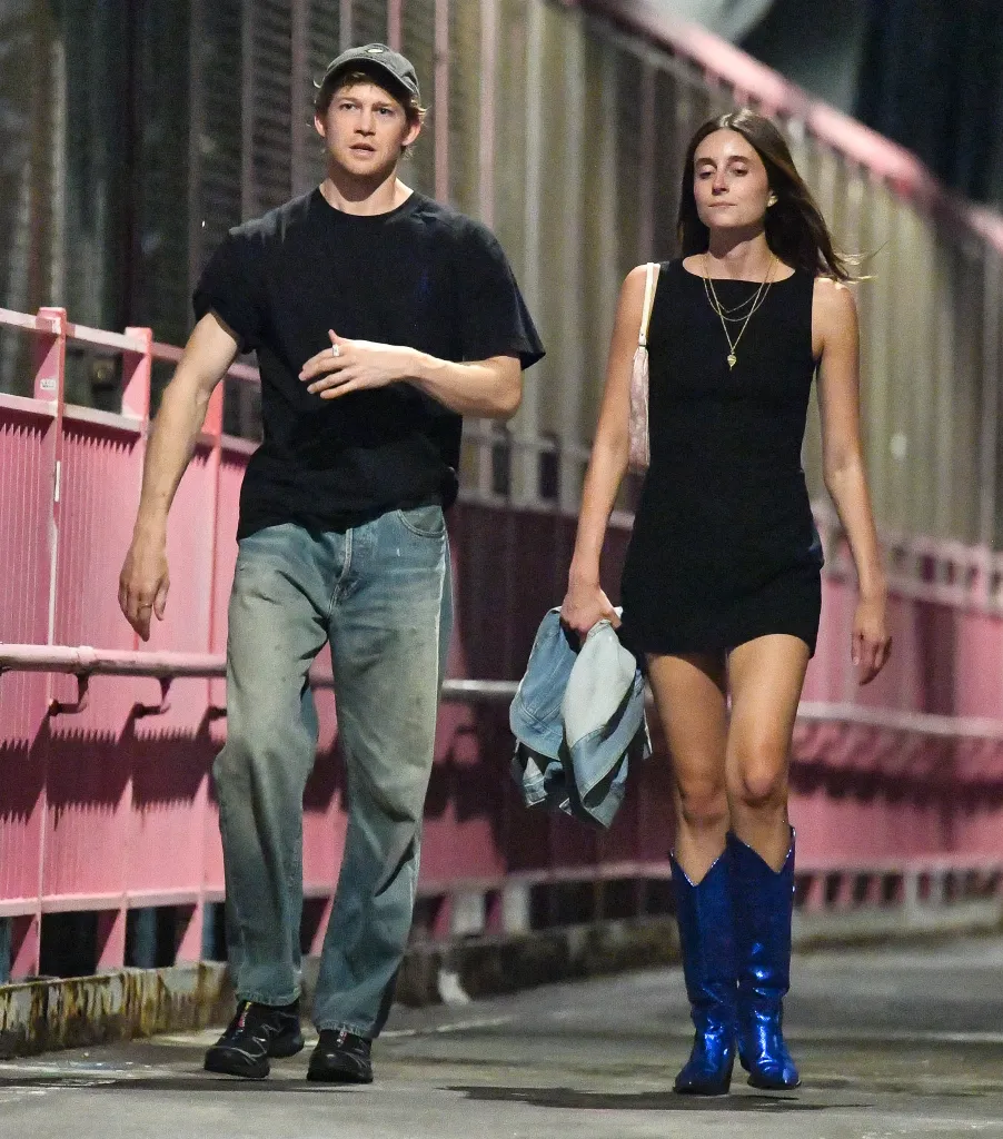 Joe Alwyn and Mary Beth Barone walking together in New York City.