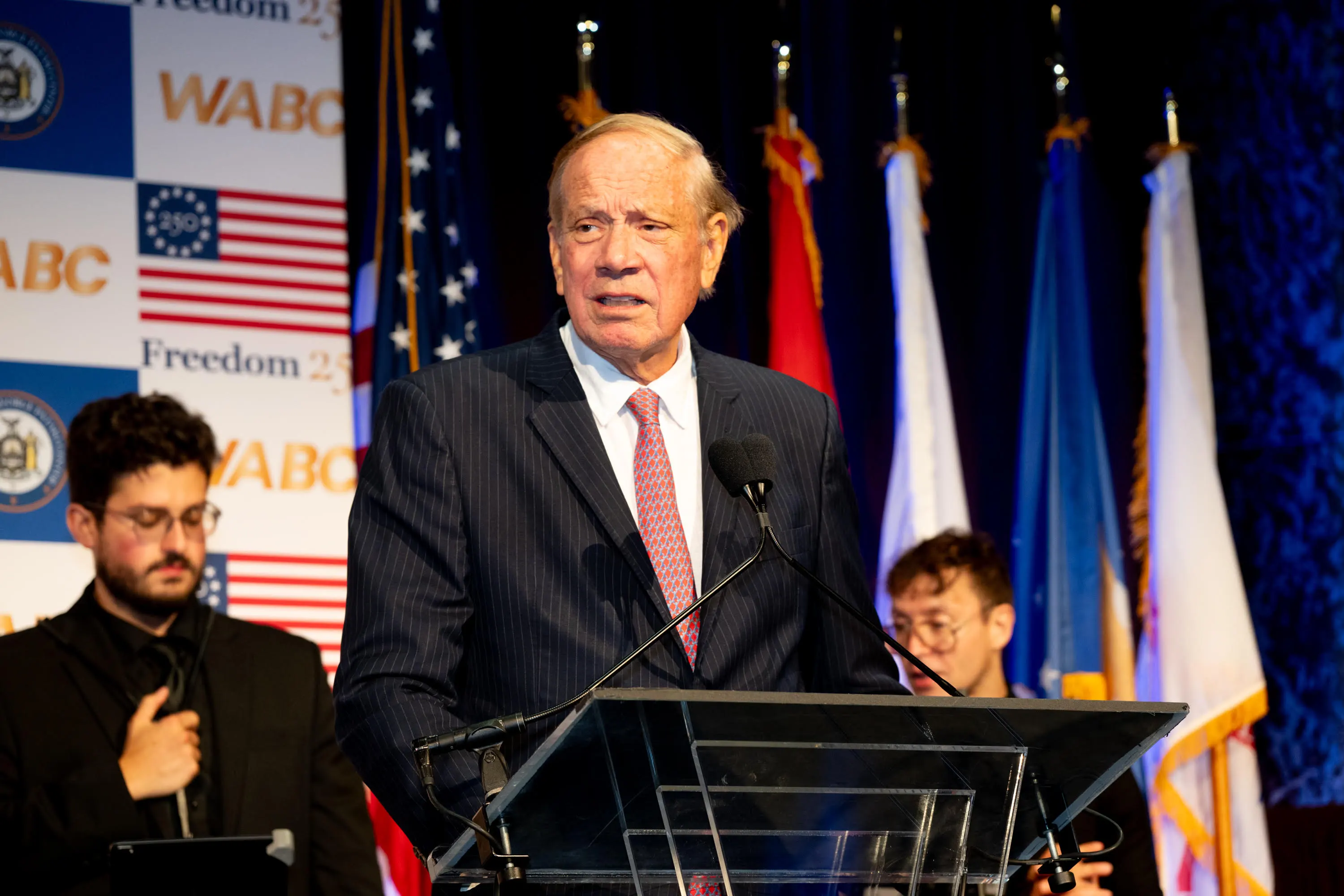 Former Gov. George Pataki speaks at a podium.