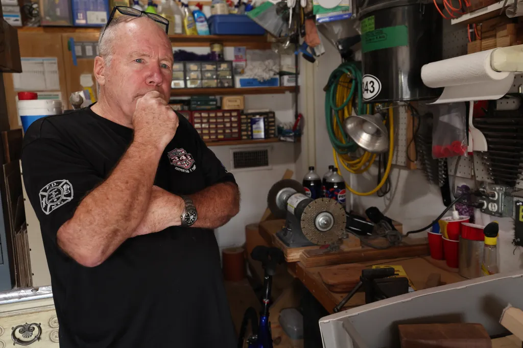 Retired FDNY Battalion Chief and 9/11 first responder John Ricketts builds models of the twin towers with recovered metal from the site at his Long Island home on Thursday, August 27, 2026.