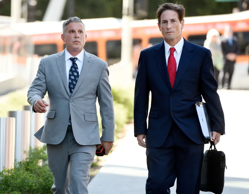 Jonathan Todd Schwartz, former business manager for Alanis Morissette, and his attorney Nathan Hochman arrive at court for Schwartz's sentencing.