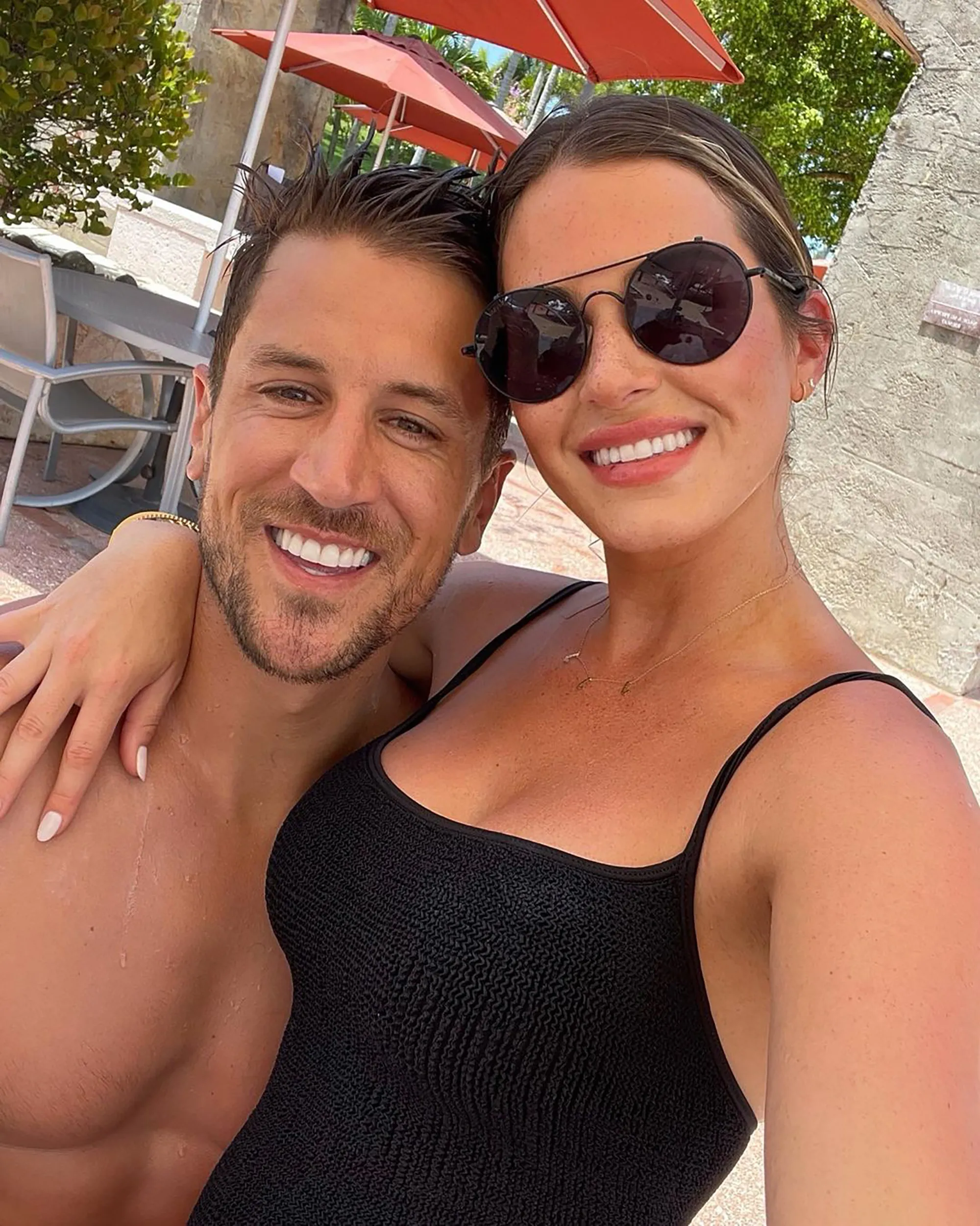 Jordan Rodgers and JoJo Fletcher smiling for a selfie outdoors.