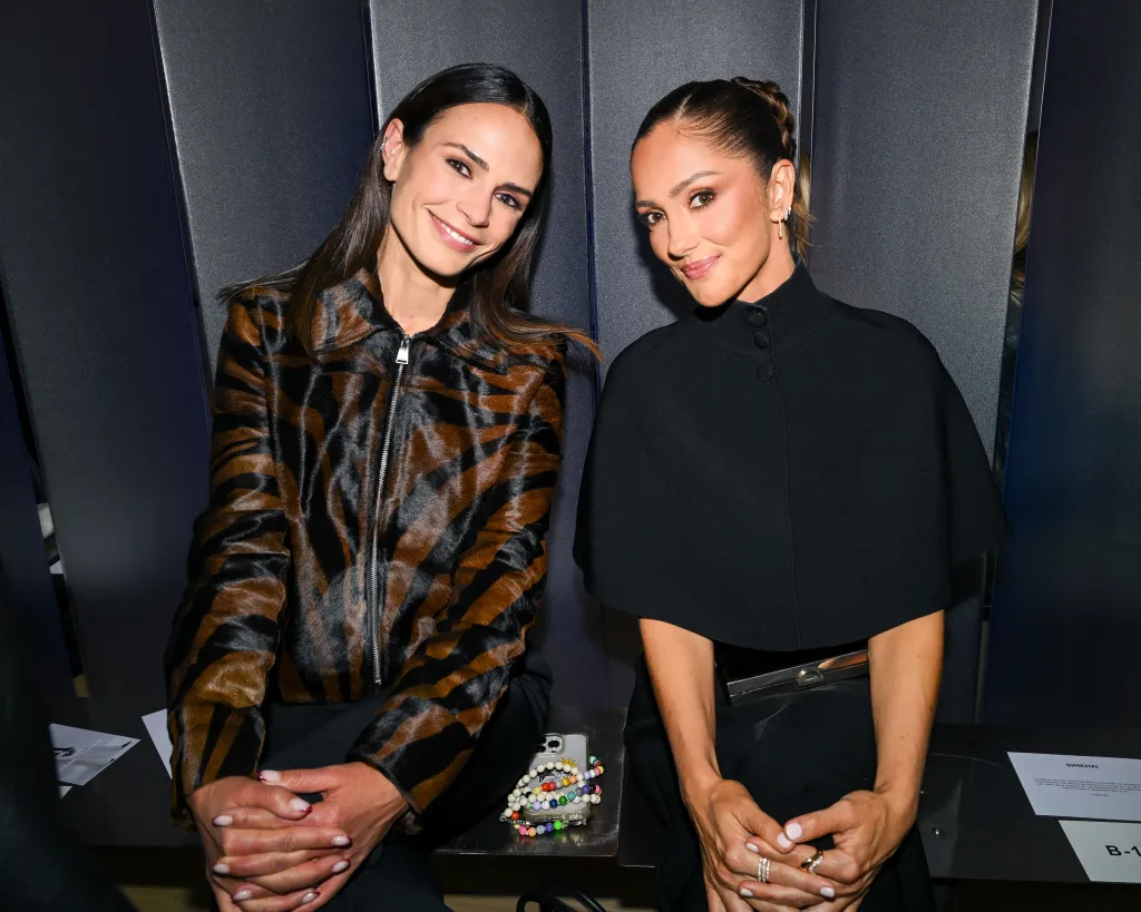 Jordana Brewster and Minka Kelly posing at the SIMKHAI SS27 Runway Show during NYFW.