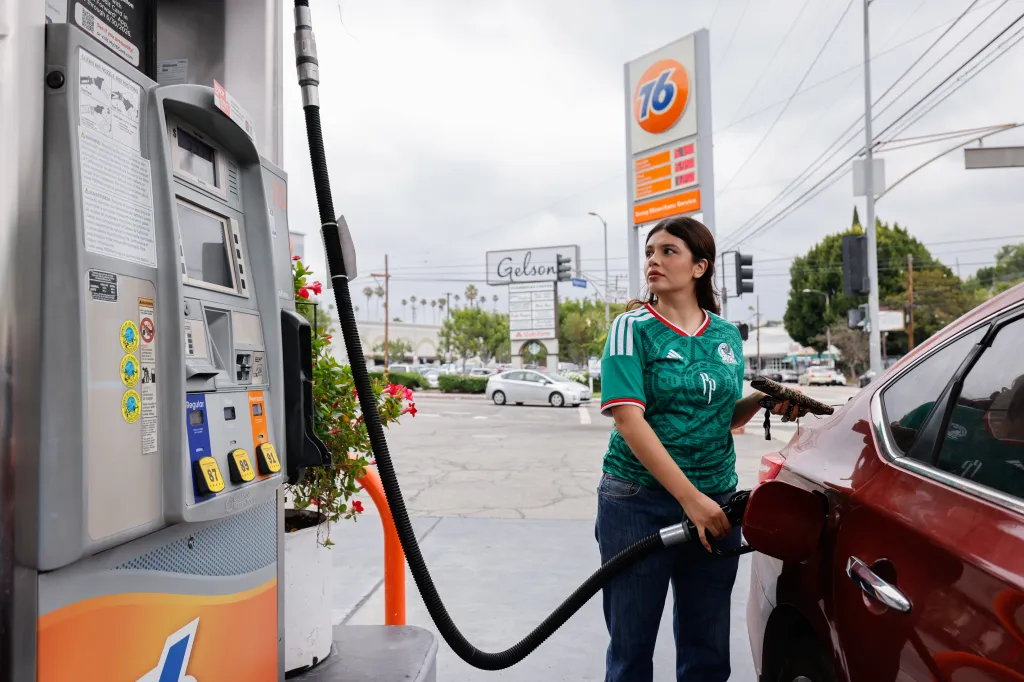 Michelle Mercado pumping gas at a 76 Station in Los Angeles.