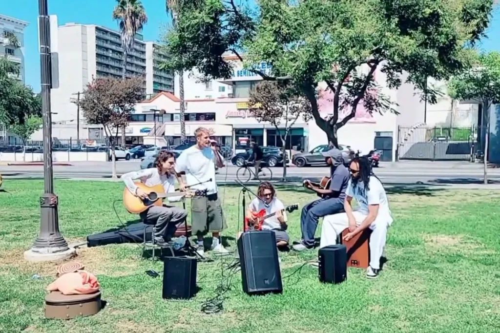 Justin Bieber performing in MacArthur Park with a band.