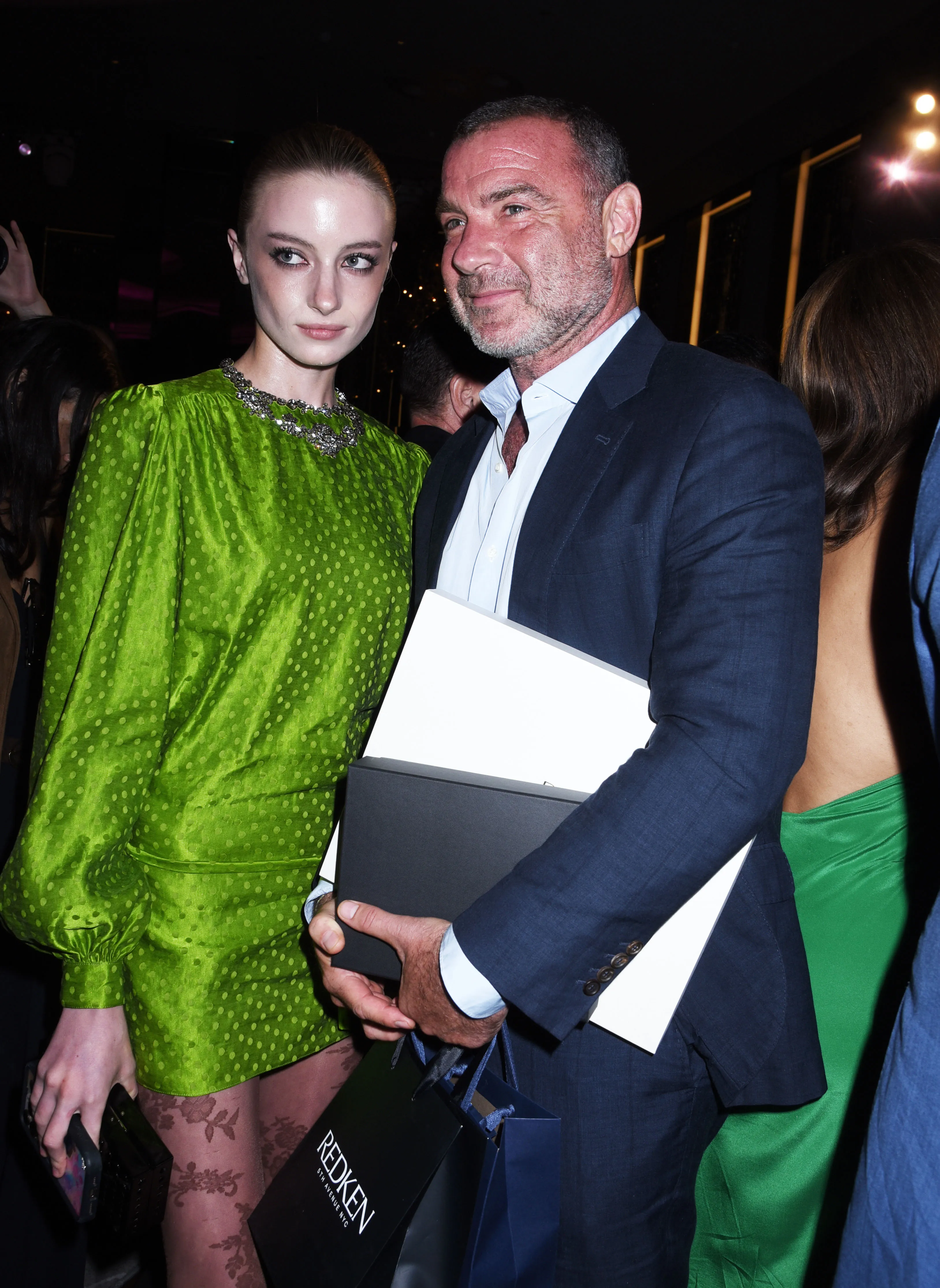 Kai Schreiber wearing a green polka dot dress and Liev Schreiber in a blue suit at The Daily Front Row's Fashion Media Awards.