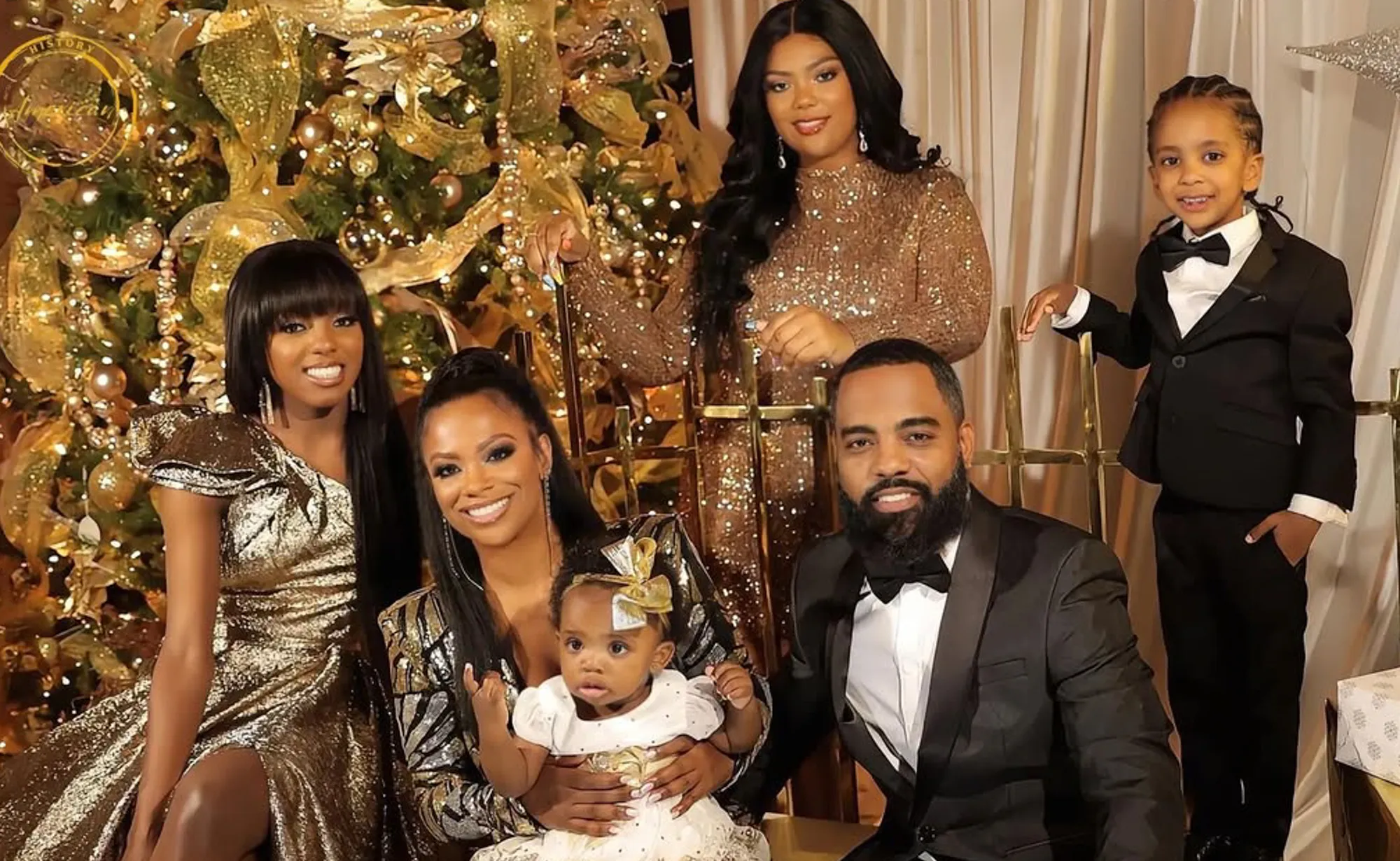 Kandi Burruss, Todd Tucker, and their children pose for a family photo.