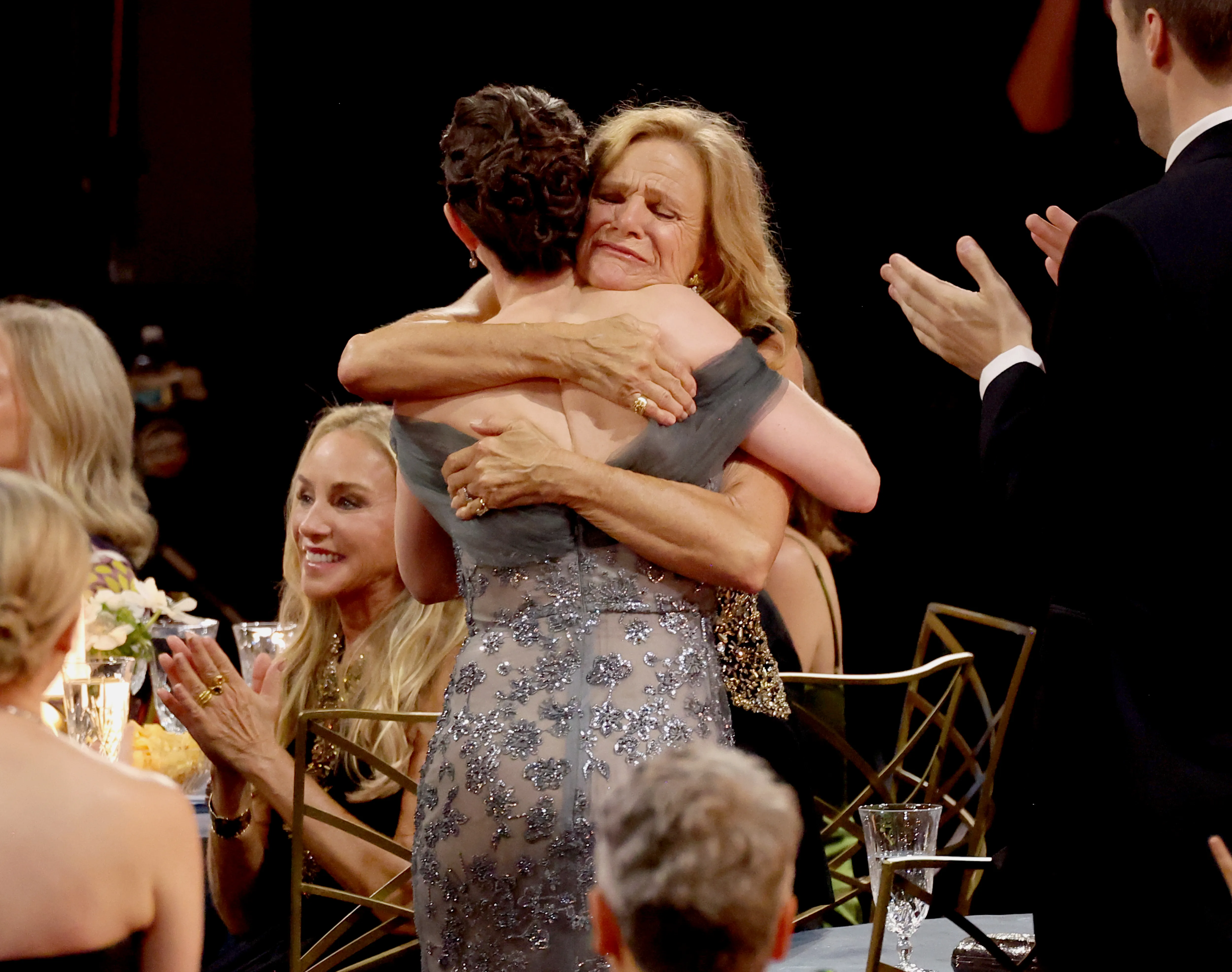 Kate O'Flynn embraces Dale Dickey.