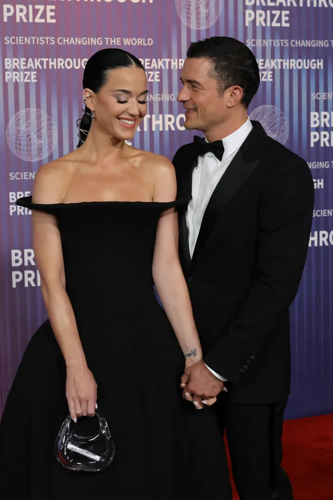 Katy Perry and Orlando Bloom holding hands at the 10th Annual Breakthrough Prize Ceremony.