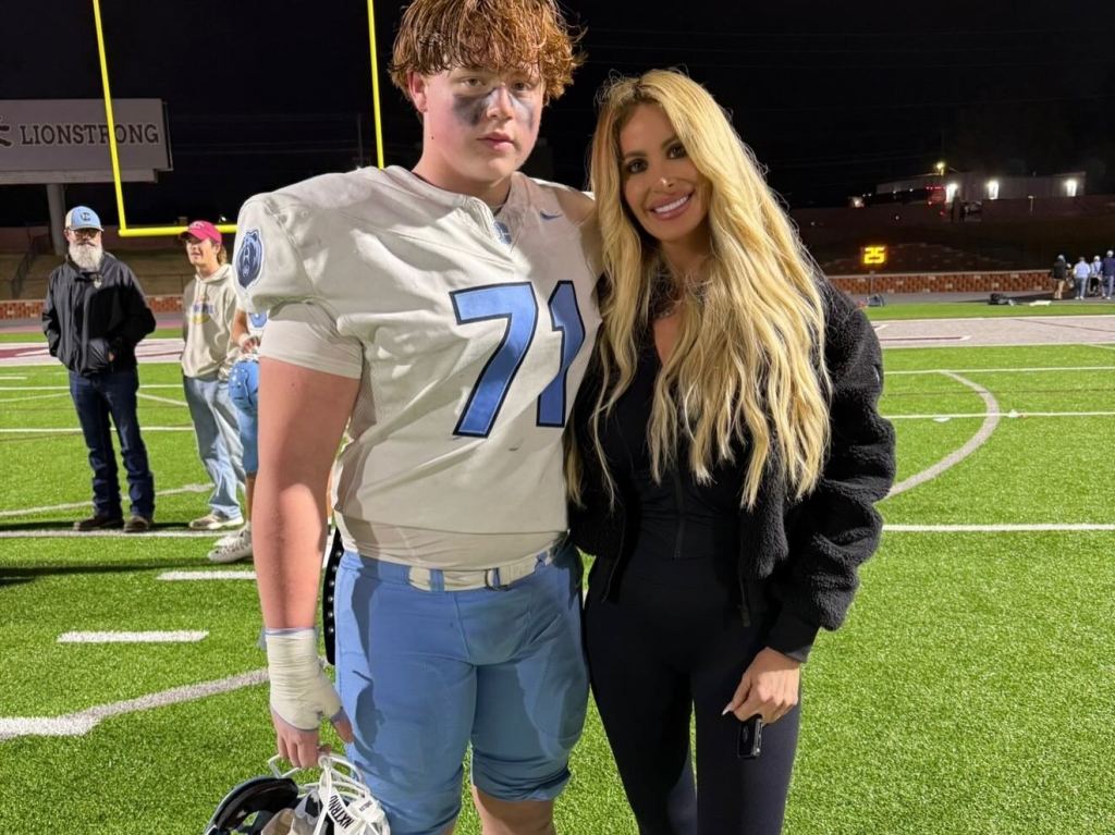 Kim Zolciak and her son KJ Biermann on a football field.