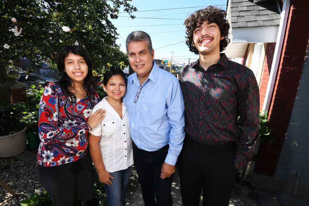 William Rodriguez, his wife Elizabeth Rendon, son William Rodriguez, and daughter Myellie Rodriguez standing together outdoors.